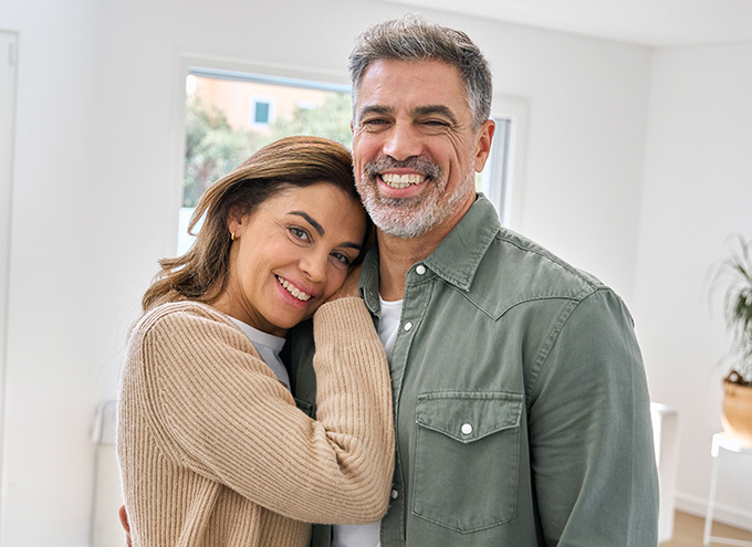 Couple embracing and smiling