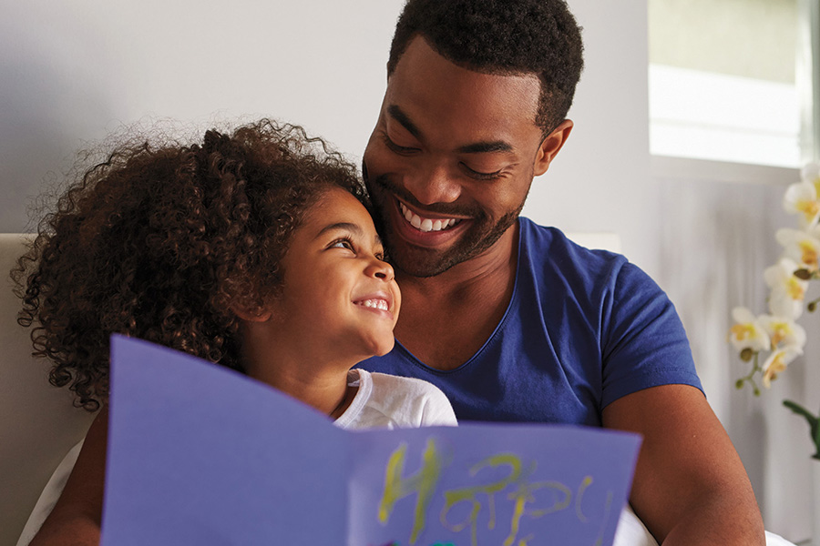 Single father reading with little girl